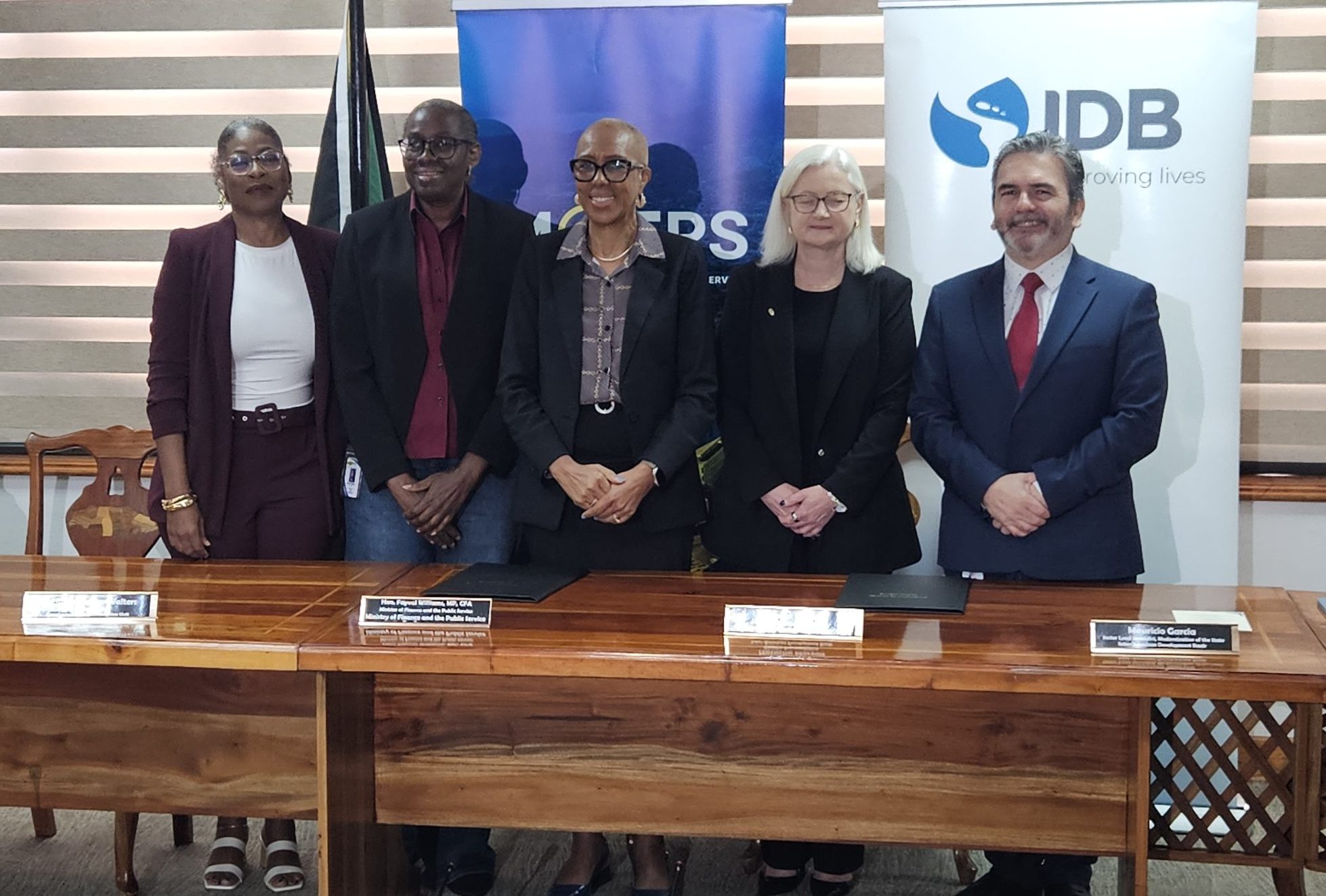 Hon. Fayval Williams, MP, CFA (centre), Minister of Finance and the Public Service, is joined by (from left) Maria Thompson Walters, Executive Director, Transformation Implementation Unit; Darlene Morrison, Financial Secretary; Natacha Marzolf, Country Representative, Inter-American Development Bank; and Mauricio Garcia, Lead Specialist in State Modernisation at the IDB, following a visibility ceremony for the signing of a new loan agreement to support the continued implementation of the Public Sector Transformation Programme. The event was held at the Ministry on Friday, March 27, 2026.